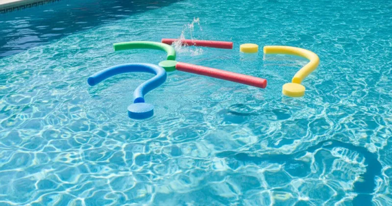 Pool technician standing on the deck beside a clean backyard pool with water testing kit