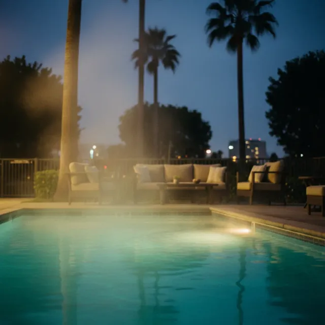 Steam rising from a heated pool on a cool San Diego evening with warm pool lights