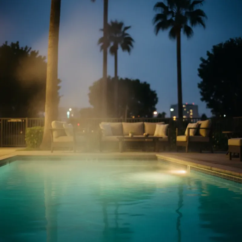 Steam rising from a heated pool on a cool San Diego evening with warm pool lights