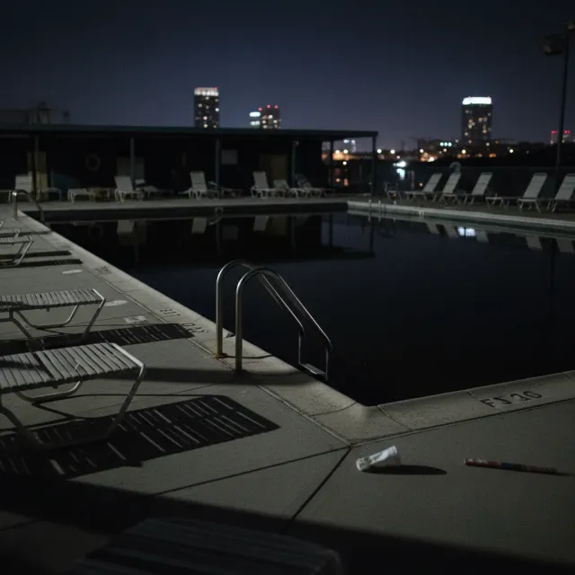 Darkened pool at night with all underwater lights out creating an unsafe environment
